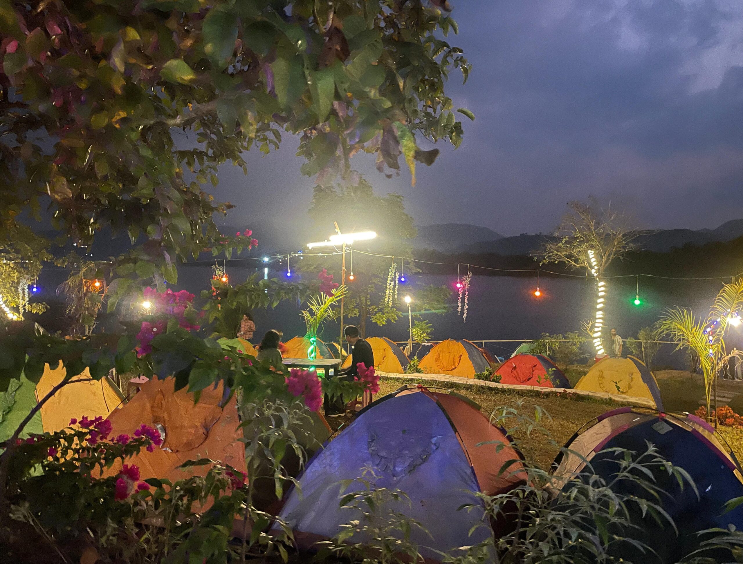 Stay on Pawna Lake luxury camping tents with night view
