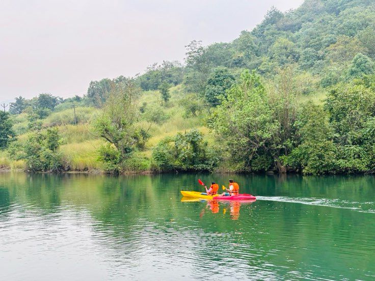 Boating on Pawna Lake surrounded by hills