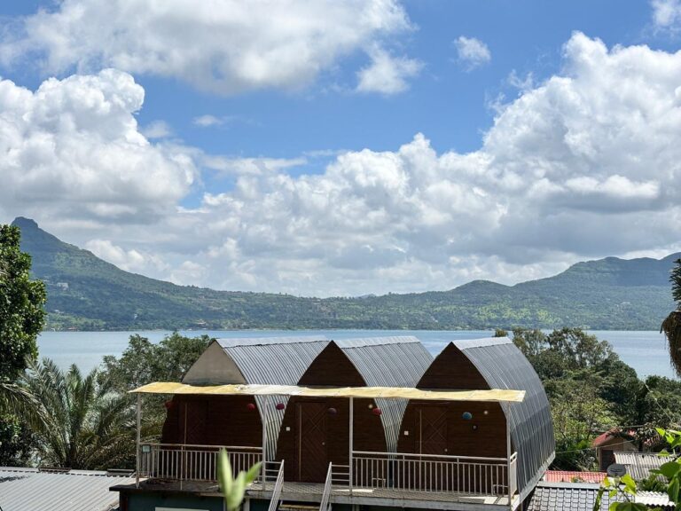 Pawna Lake camping for couples in winter – cozy lakeside cottage with balcony and sunset view